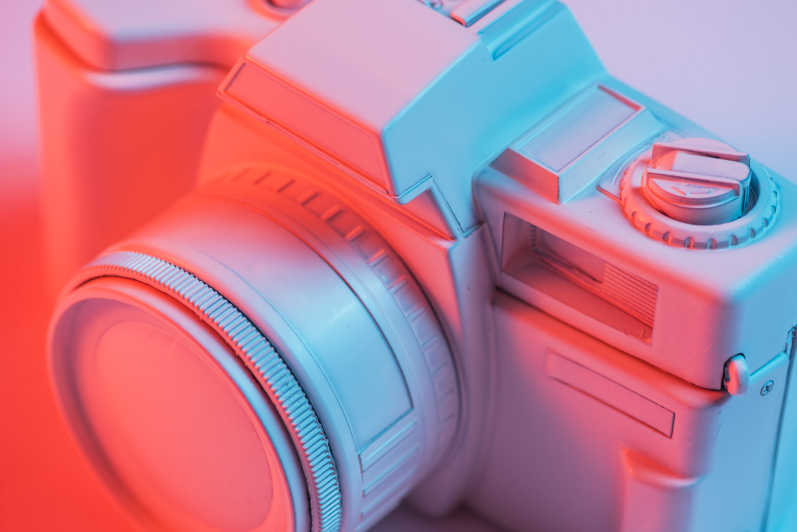 close-up-retro-pink-camera-with-blue-light